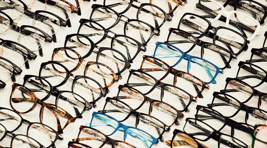 various eyeglass frames laid out on a table